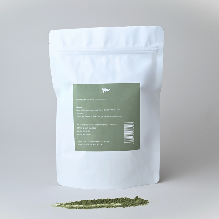 White packaging with a green label on a gray background