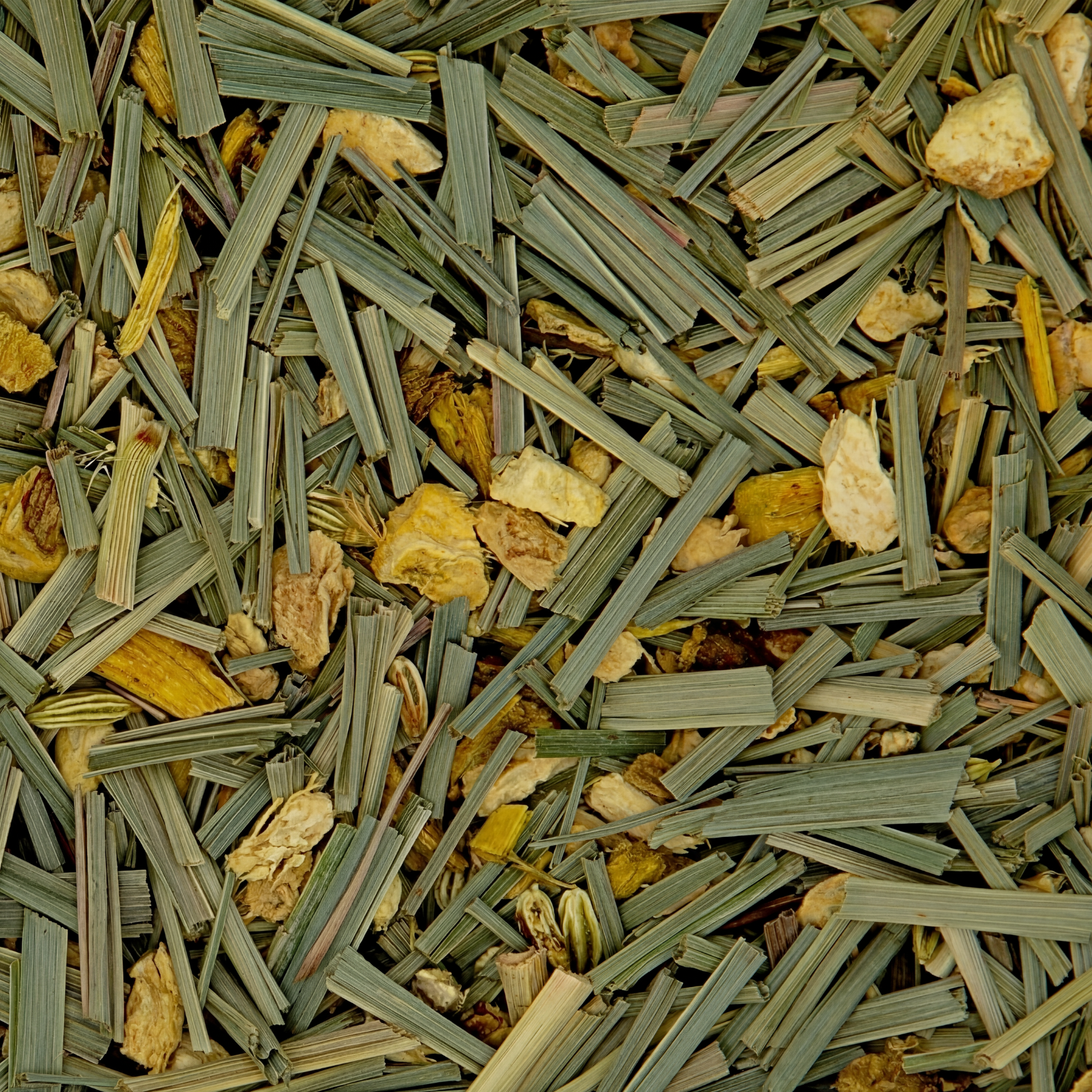 Close-up of dried herbs and plants with green, yellow, and brown colors.